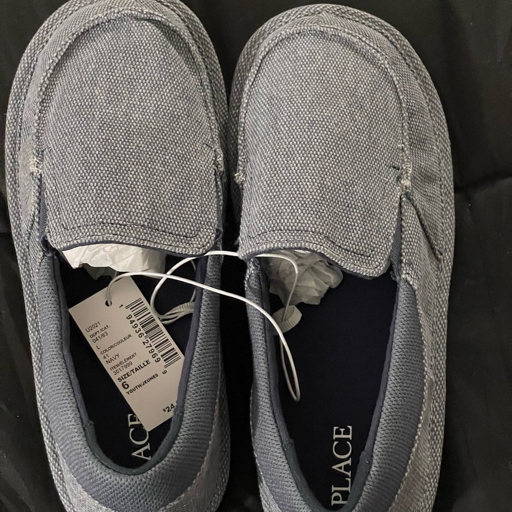 Jean colored, boy’s size 5 moccasins, never worn.